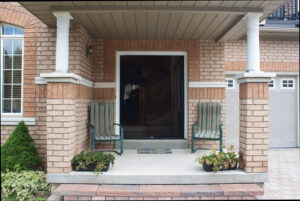 Vista One - Foldaway Series on the front double door of a home.