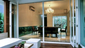 Vista One - Foldaway Series on a large glass wall to a large outdoor patio living space.