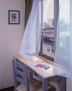 Vista One - Foldaway Series on a office with by a desk.
