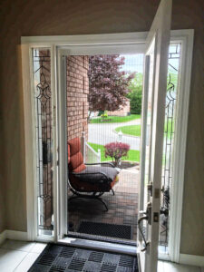 Vista One - Rollaway Series on single front door with door open to front porch.