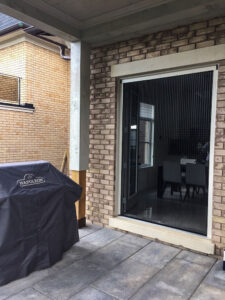 Vista One - Foldaway Series on double french doors from covered patio to dining room.