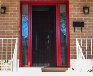 Vista One - Rollaway Screen single front door in red trim.