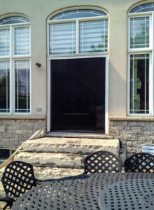 Vista One - Foldaway Screen large double door opening to the backyard patio.