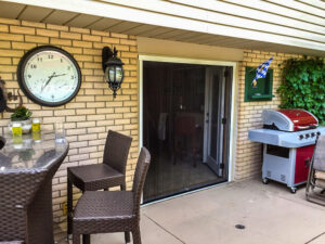 Vista One - Foldaway Screen large double door opening the backyard large deck.