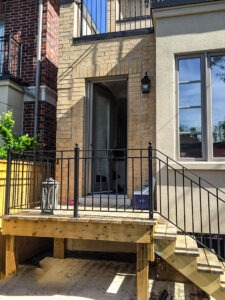 Vista One - Rollaway Screen on single front doorway on brick townhouse.